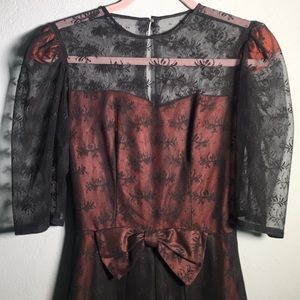 Vintage lace black dress w bow, rust color slip.
